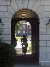 A bicyclist riding through a tunnel