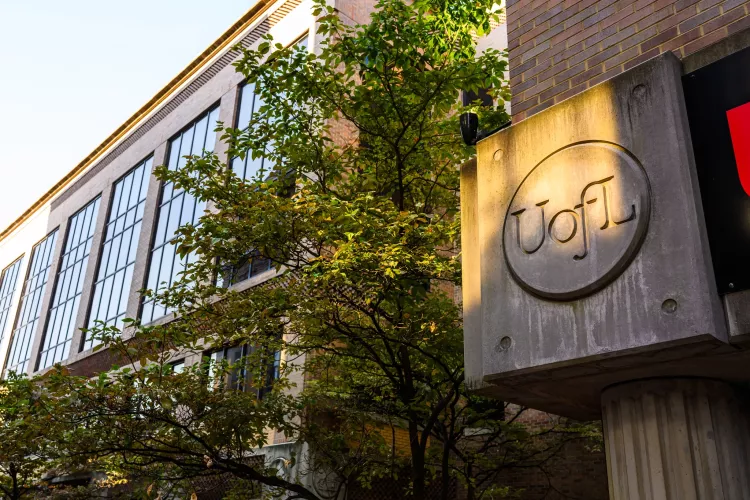 Exterior of the School of Nursing on the HSC Campus as sunset approaches.