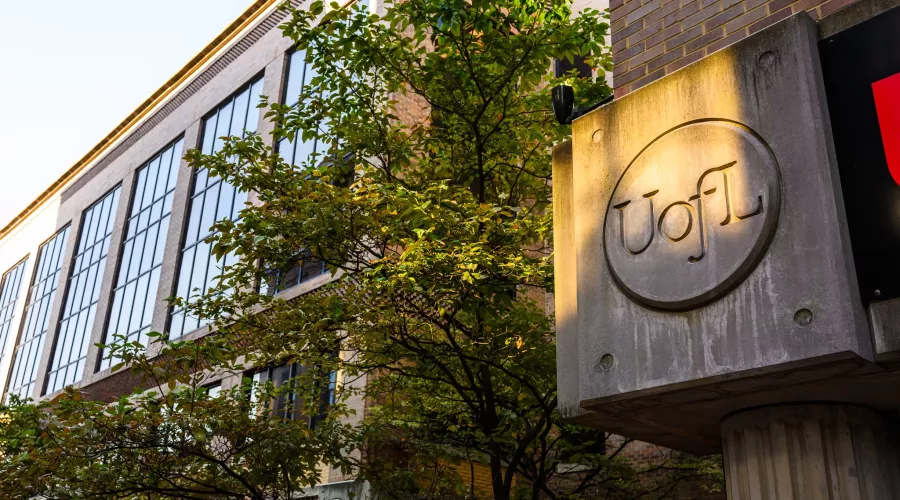 Exterior of the School of Nursing on the HSC Campus as sunset approaches.