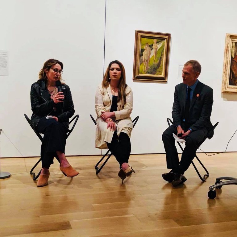 Three people sit for a talk in the Louisville Speed Art Museum