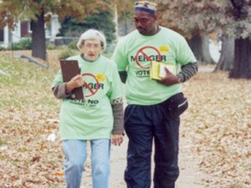 Anne Braden and African American man walking