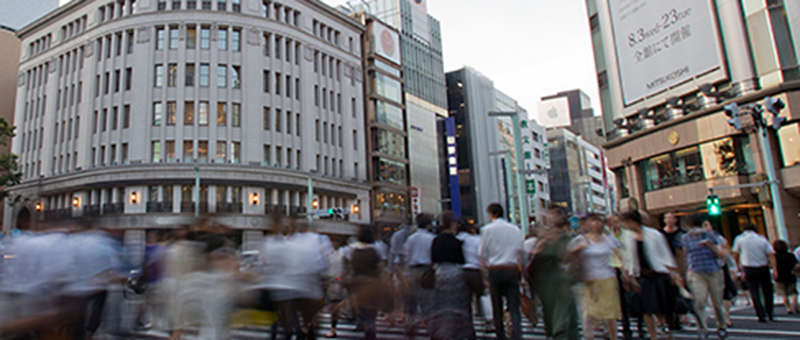 busy Asian city with people walking in street