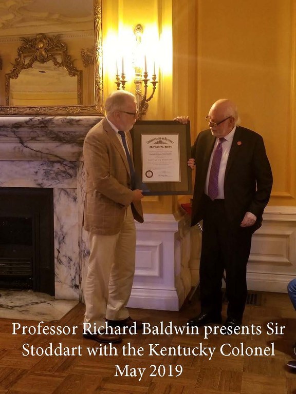 Professor Richard Baldwin, presents Sir Stoddart with the Kentucky Colonel