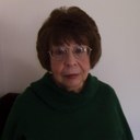 Betty Booth Donohue has brown hair and green eyes. Betty Booth Donohue