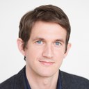 Dr. Frank Kelderman, a White man with blue eyes and brown hair, against a light background, wearing a blue button-down shirt and a dark-gray blazer. Frank Kelderman