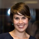 Maria Novotny, a white woman with short, pixie-cut length brown hair in a blue blouse. Maria Novotny