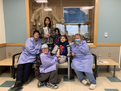 Dr. Roalofs (left) with clinic staff and three adorable sisters from Savoonga, Alaska. Savoonga is a remote village on St. Lawrence Island in the middle of the Bering Sea.