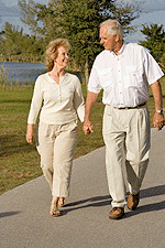 Couple exercising by walking in a park