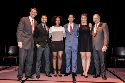 Doctor Mardis posing on stage with several of the 2017 Student Award winners.