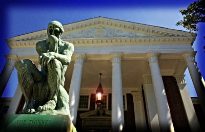 photo of Thinker state against Grawmeyer Hall and blue sky