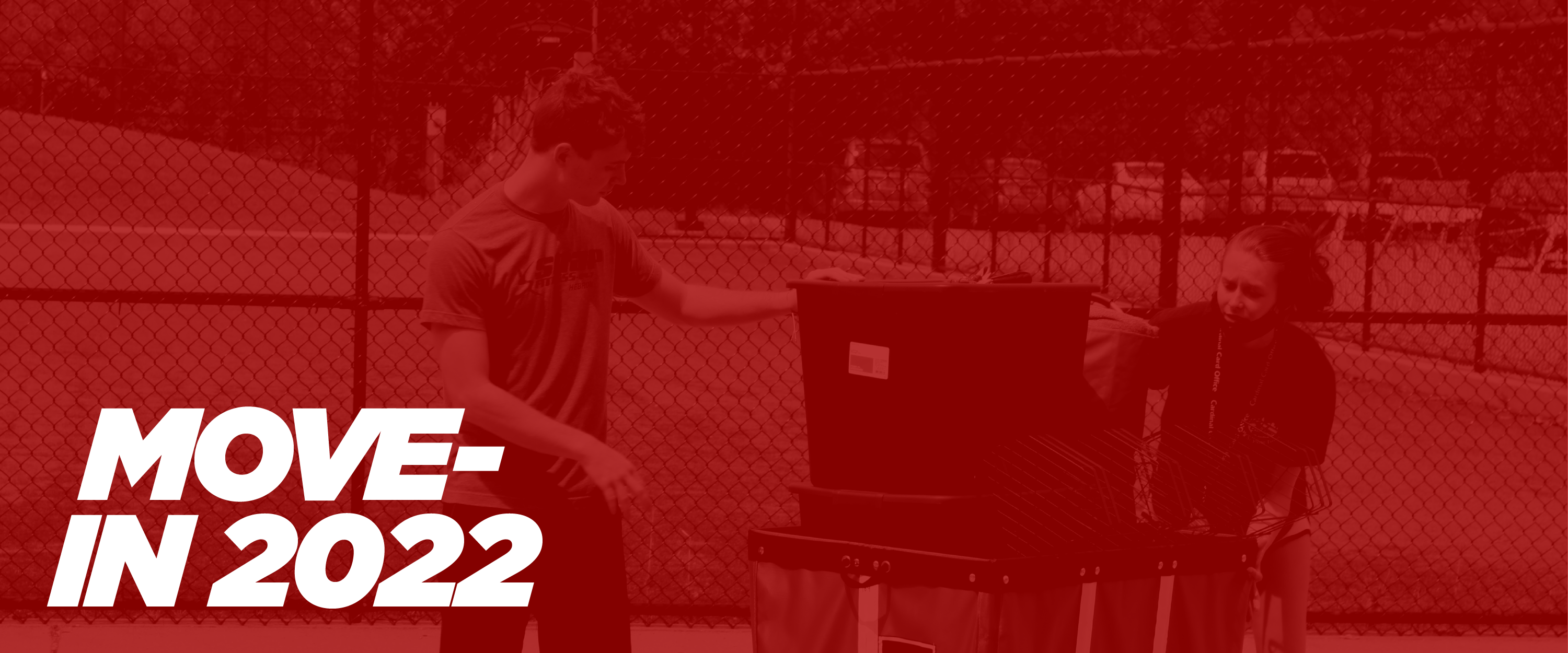 move-in 2022. two students with a moving bin