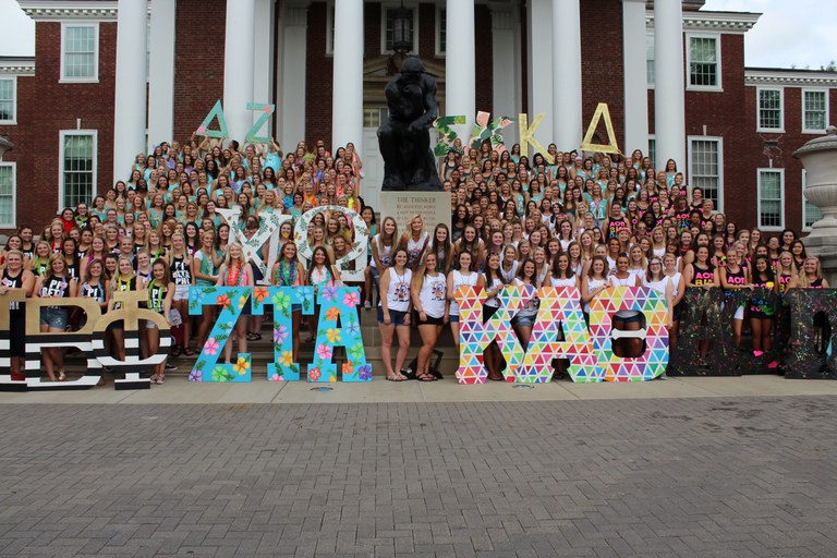 The various panhellenic groups posing together on the steps of Grawemeyer hall.