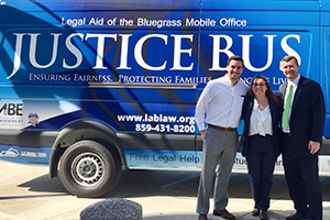 From left, Dominic Donovan, Caitlin Kidd and Joshua Fain with Legal Aid of the Bluegrass' Justice Bus.