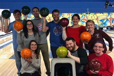 Professor Justin Walker and research assistants go bowling.