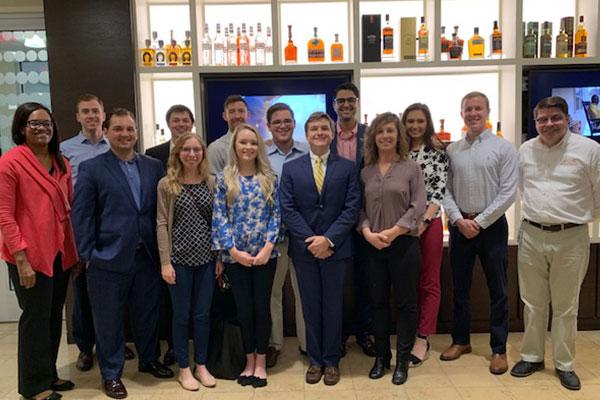 Jaileah X. Huddleston, VP, Assistant General Counsel and Assistant Corporate Secretary at Brown-Forman, left, and Louisville Law M&A students.