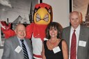 Alumni mingle with Louie, the Cardinal bird