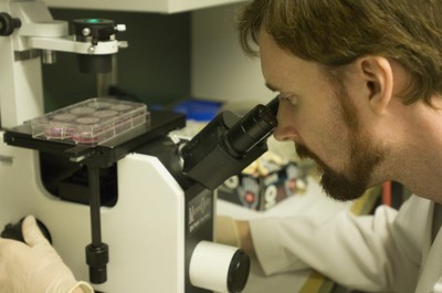 Graduate Student with Microscope