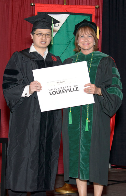 Huy Le, M.D., Ph.D. with Toni Ganzel, M.D., Dean, University of Louisville School of Medicine