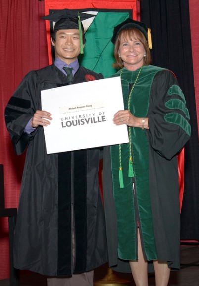 Michael Zhang, M.D, Ph.D. with Toni Ganzel, M.D., Dean, University of Louisville School of Medicine