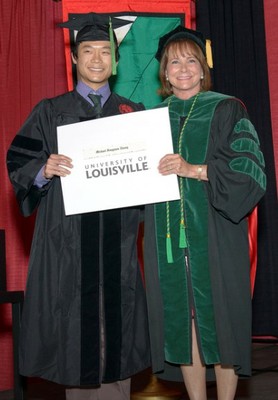 Michael Zhang, M.D, Ph.D. with Toni Ganzel, M.D., Dean, University of Louisville School of Medicine