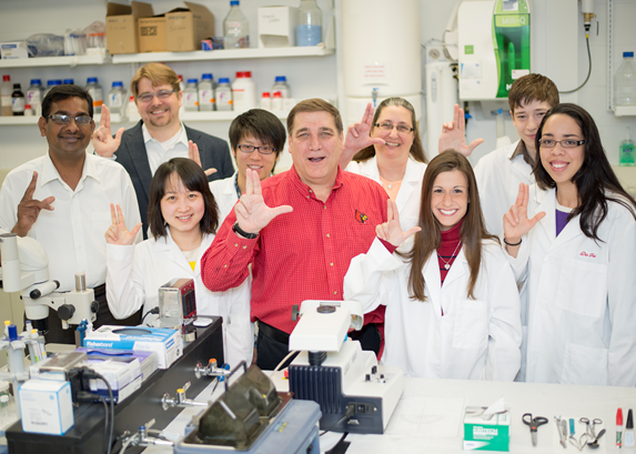 Image of Department Chair Dr William Guido posing with research staff and students