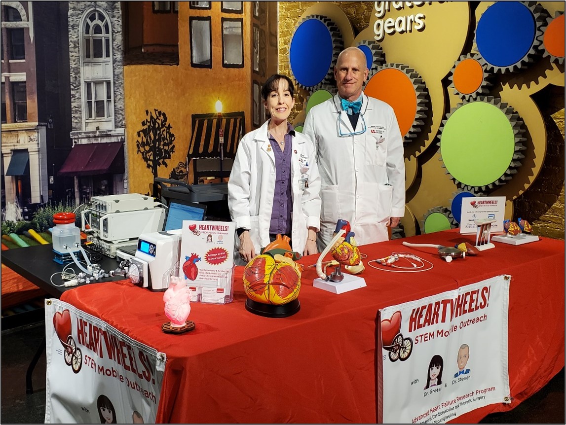 Image of Drs. Monreal and Koenig at Heartwheels table 