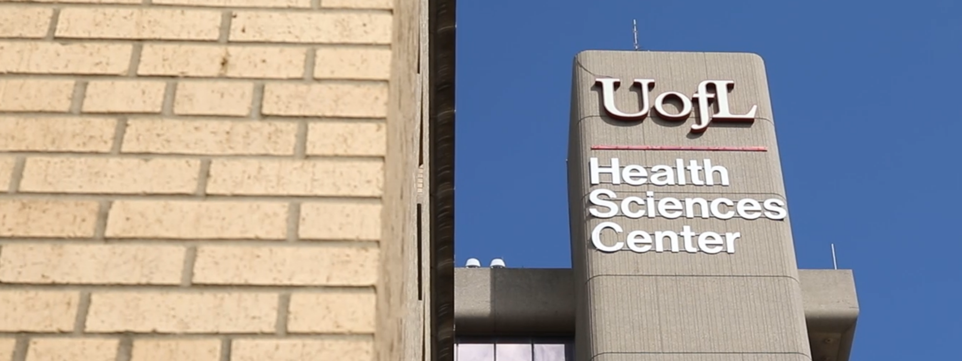 Photo of the UofL Health Sciences Center sign on the School of Medicine Research Tower.