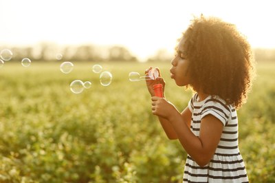 child blowing air