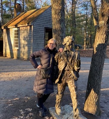 Amy at Walden Pond, Massachusetts, next to Thoreau statue
