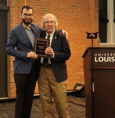 Dr. Caudill presenting a  resident award