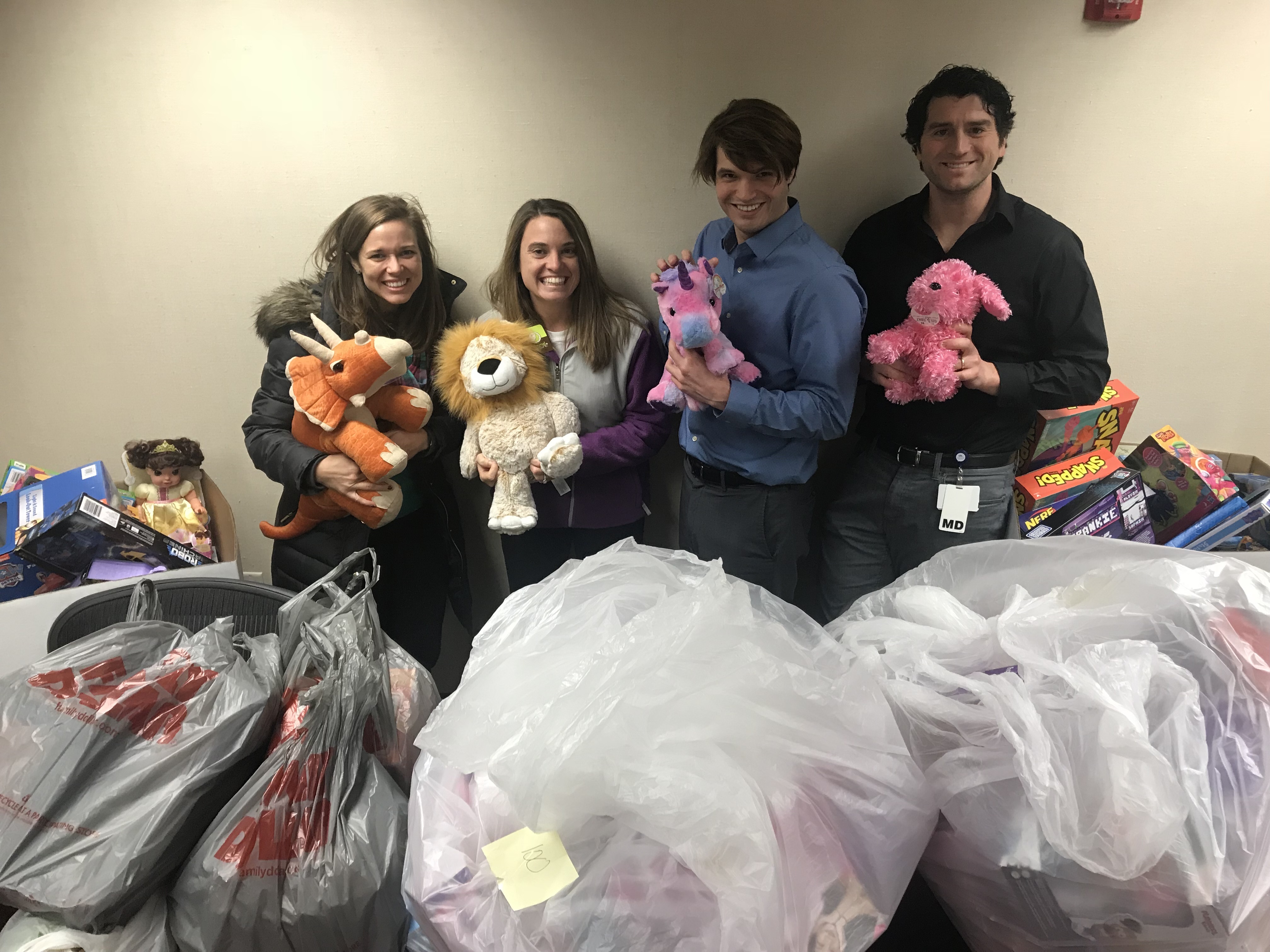 Residents with toys at the toy drive