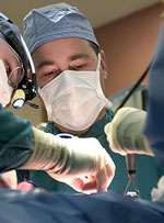 3 surgeons perform an operation