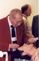 Dr. Paris with a mannequin used to train medical students