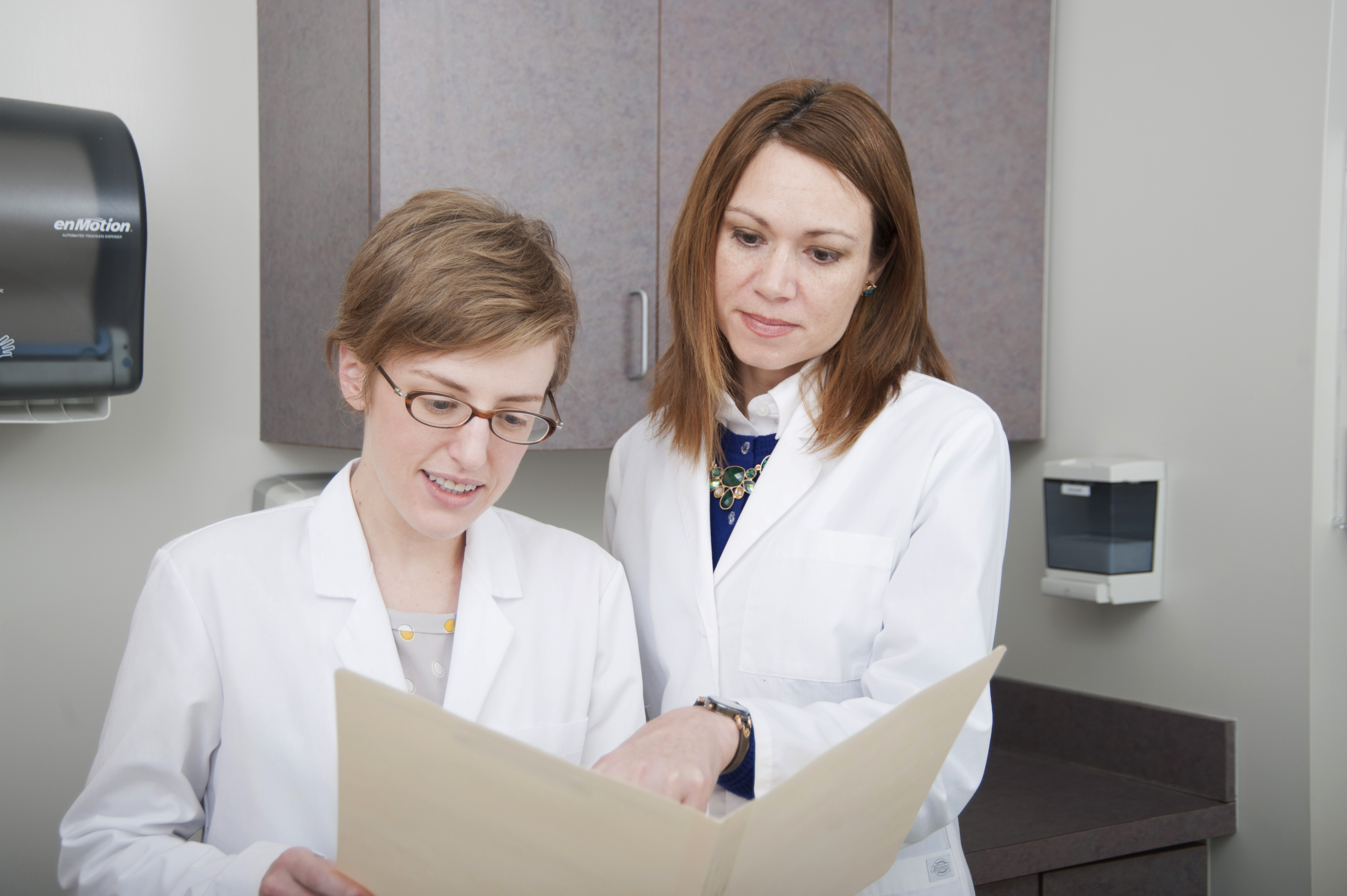 two students review a patient’s chart