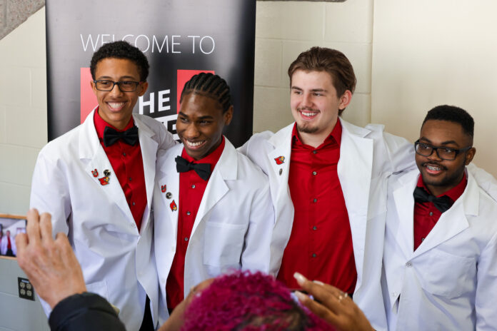 Central High School students in Pre-Medical Magnet Program receive white coats at UofL