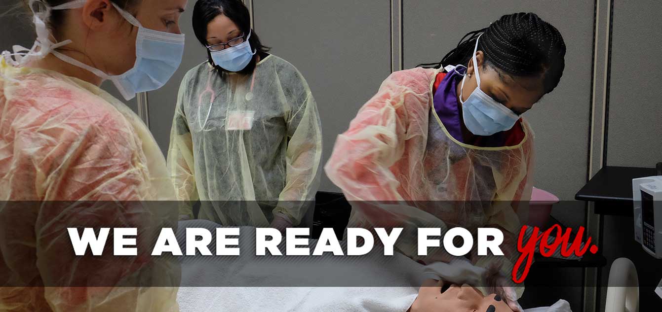 Photo of two nursing students in a simulation lab with a mannequin overseen by faculty with overlay that reads 'We are ready for you.'