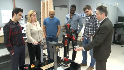 Nursing and engineering team with nursing robot