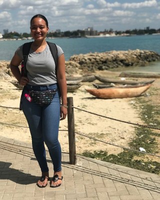 Photo of Cierra Battle standing on waterfront in Tanzania.