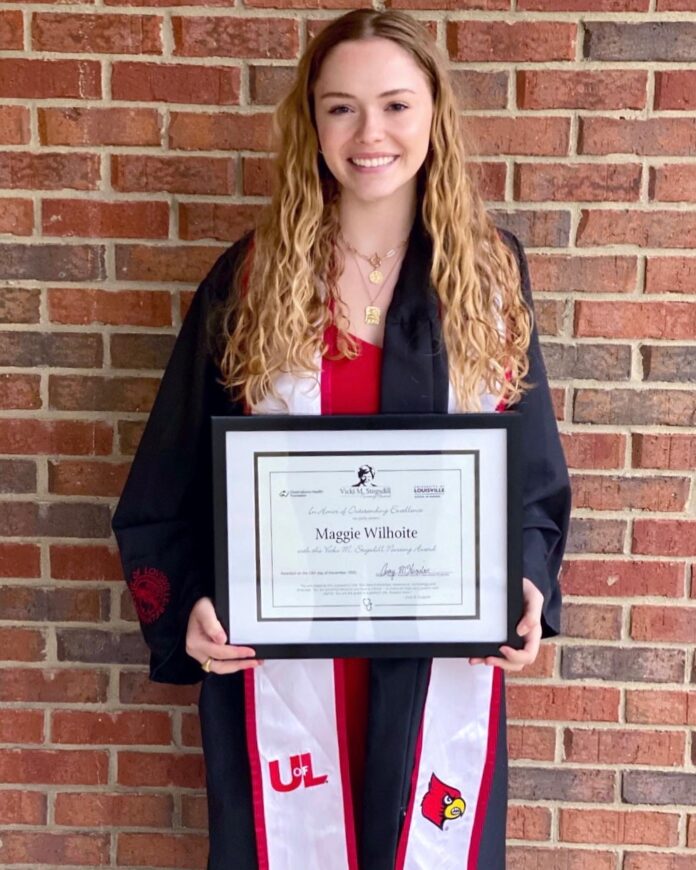 Maggie Wilhoite with her award certificate.