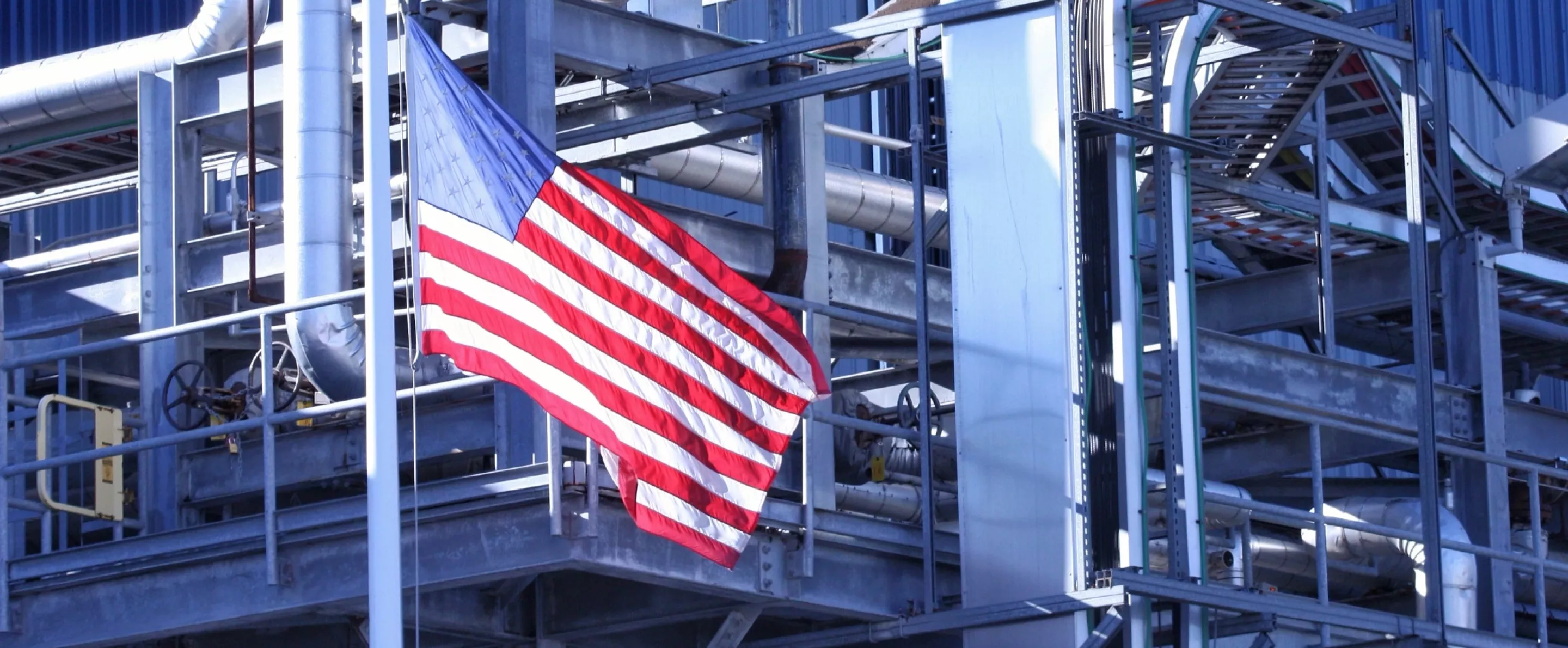 American Flag flying in front of manufacturing factory