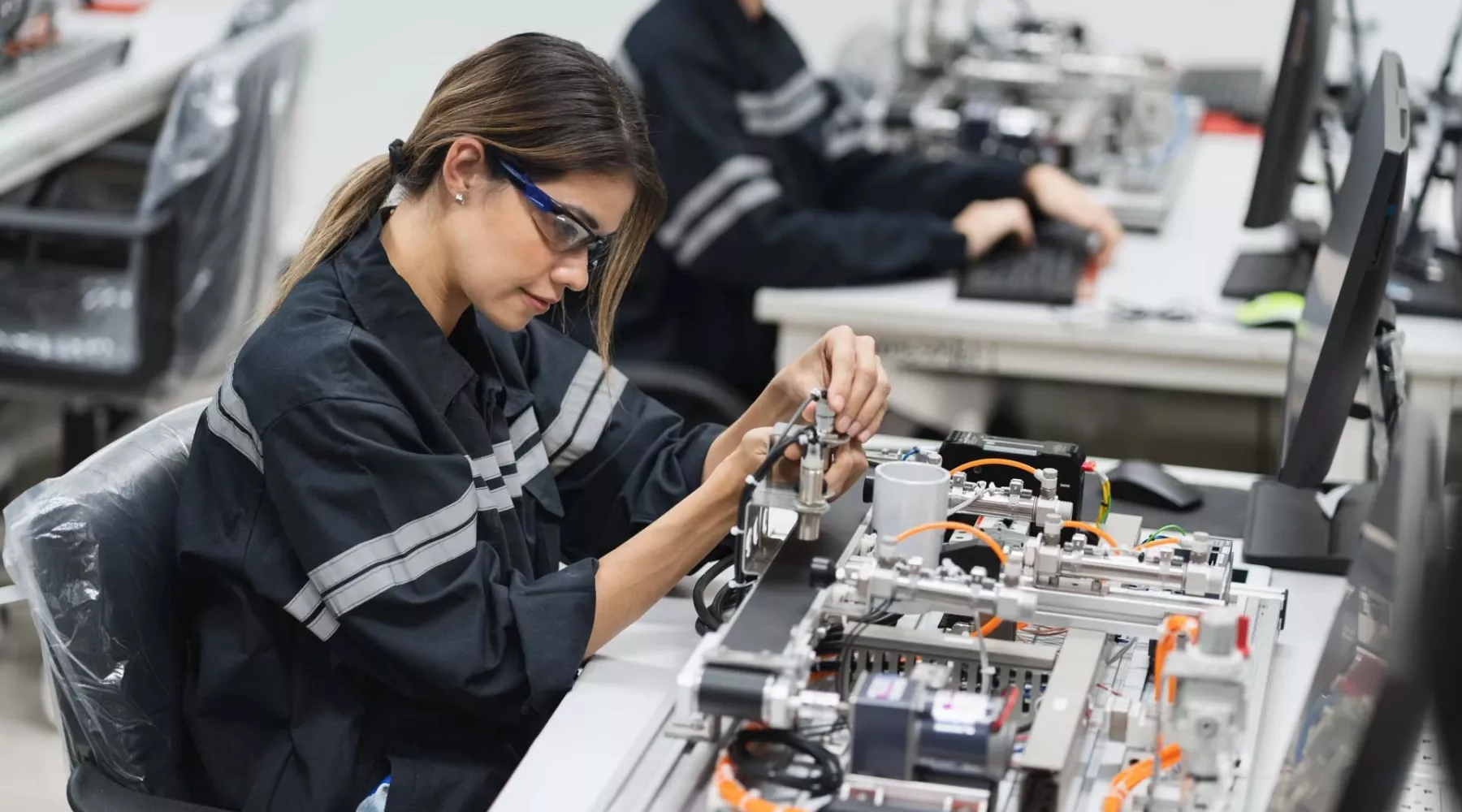 Engineer Caucasian woman learning repair electric board in class
