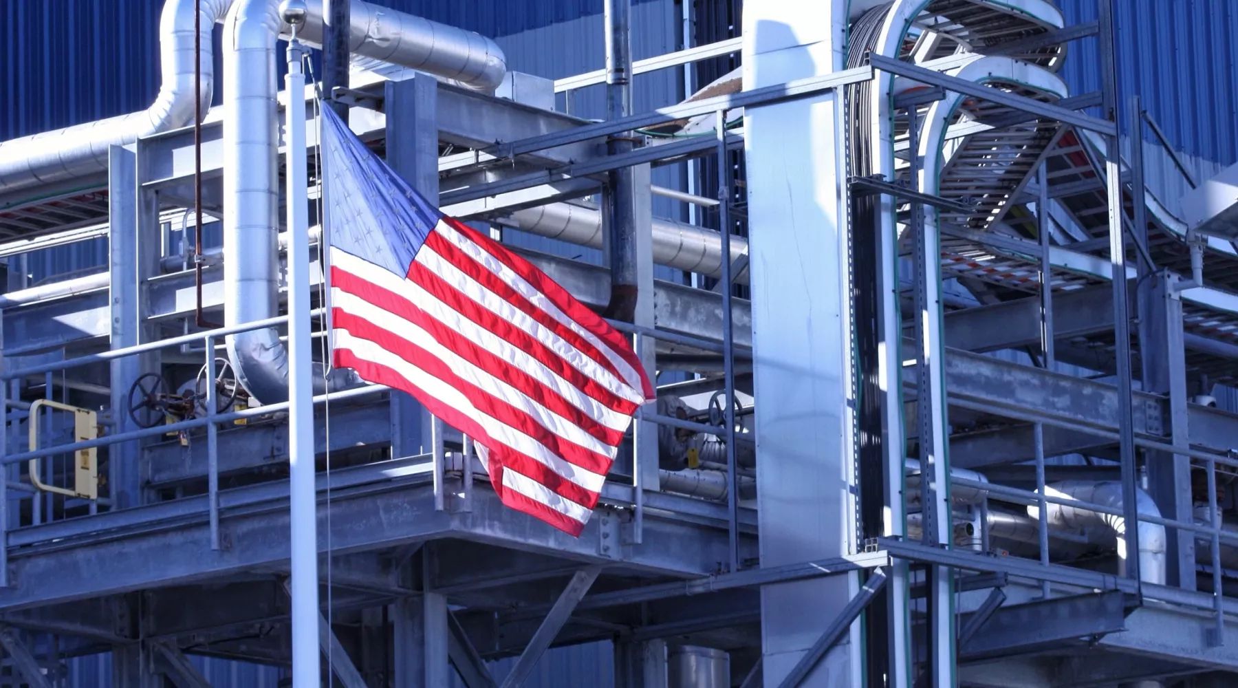 American Flag flying in front of manufacturing factory