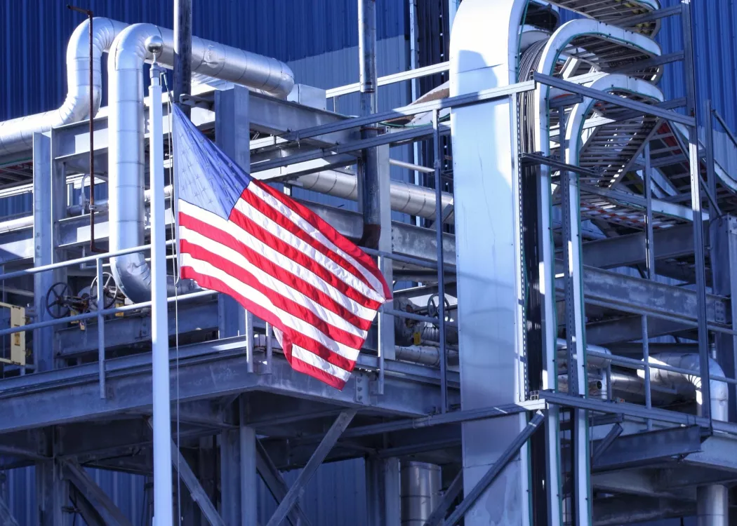 American Flag flying in front of manufacturing factory