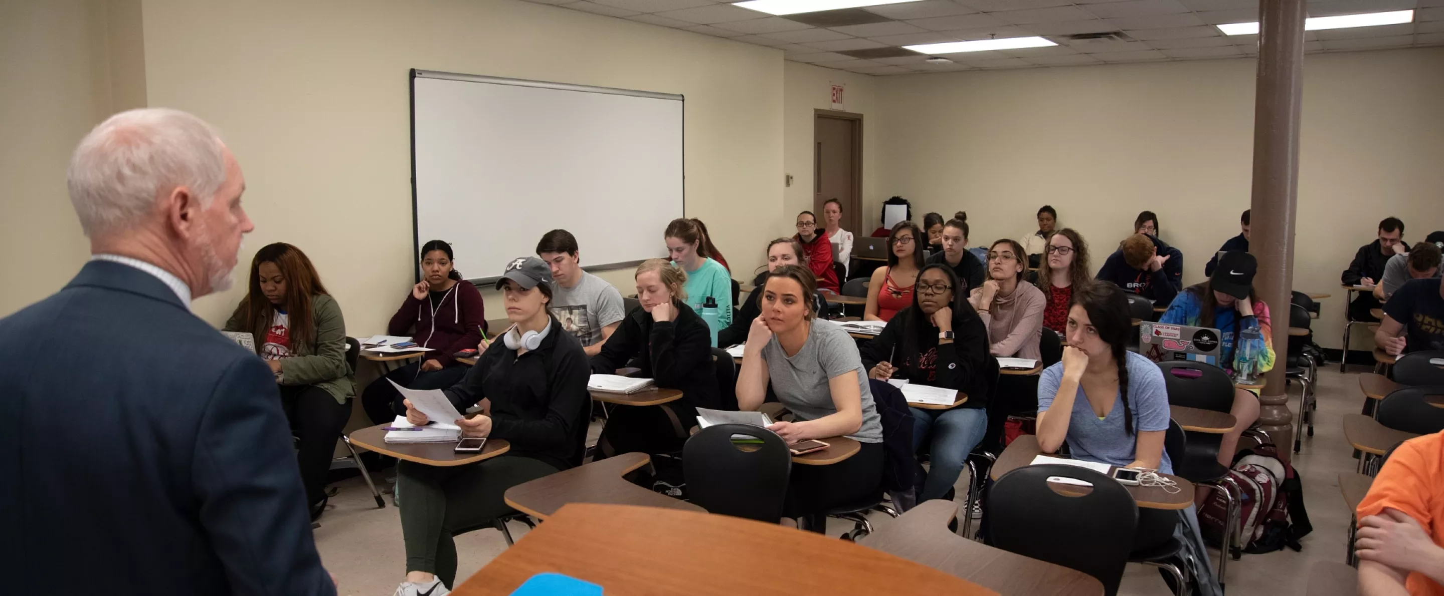 Students listen to their professor's lecture in a Criminal Justice class