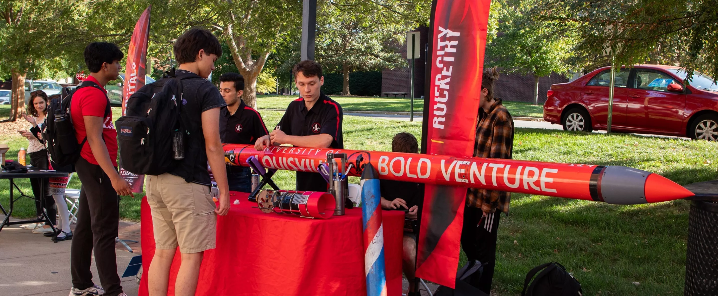 River City Rocketry showing off one of their rockets during a Fall Festival campus event.