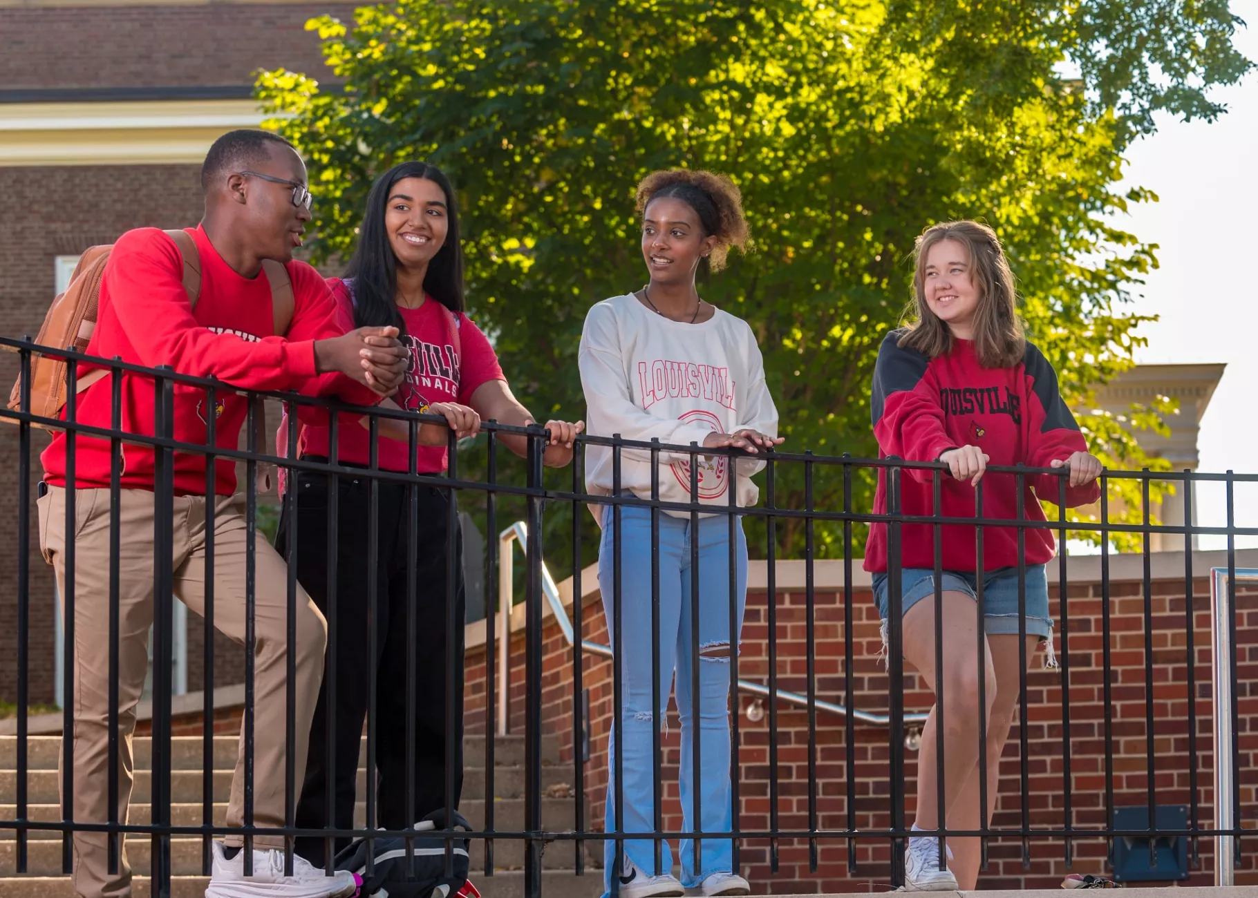 A group of students talking on campus