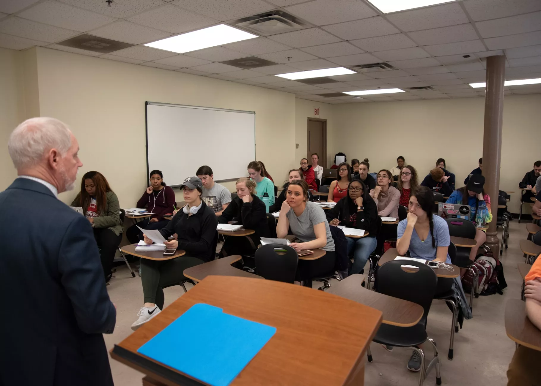 Students listen to their professor's lecture in a Criminal Justice class