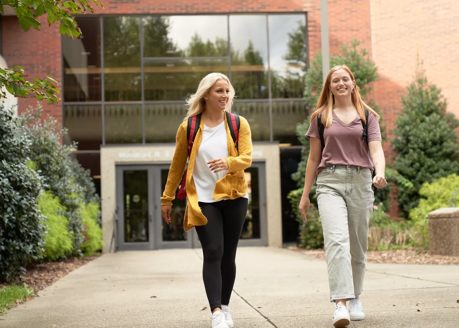 Two students walking from the CEHD.
