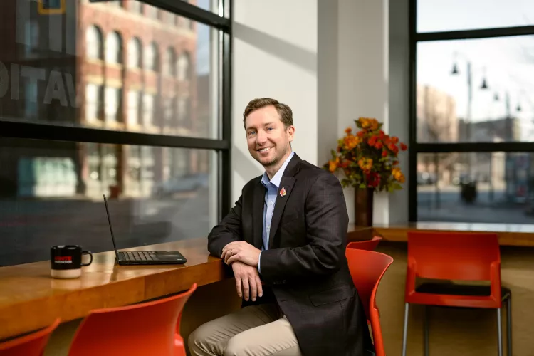 Will Metcalf sitting at a desk
