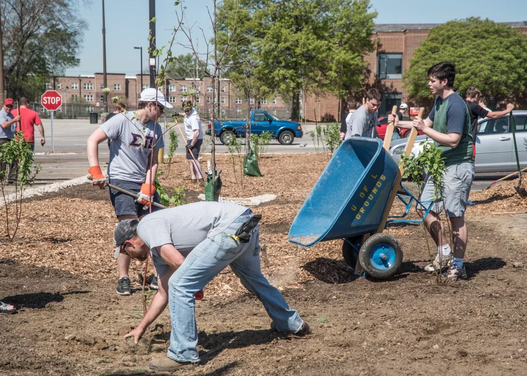 Students work on the rain garden